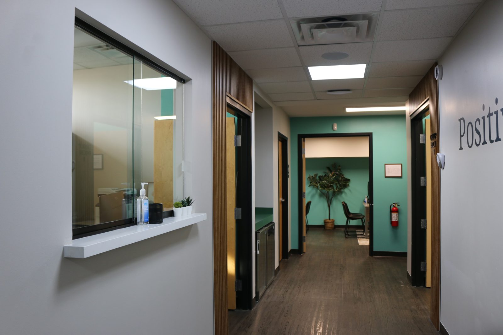 The hallway at PATH Health Services in Tempe, with the reception window on the left and the treatment rooms along the corridor