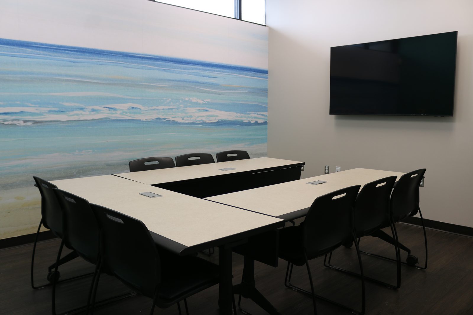 The second group room at PATH Health Services in Tempe, with a shoreline mural along one wall