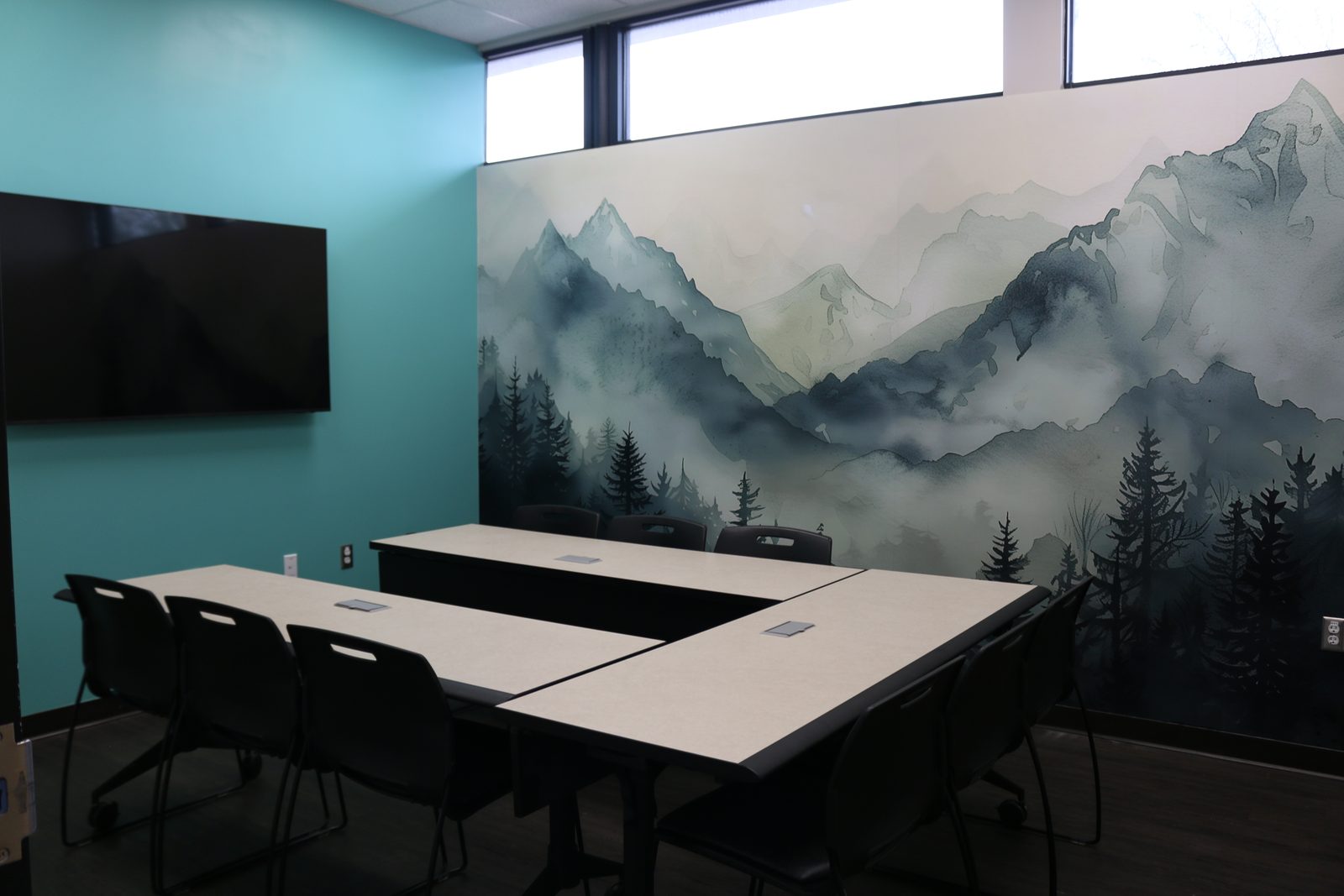 The group room at PATH Health Services in Tempe, with a mountain mural along one wall